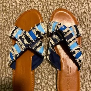 Tom’s flip flops. Worn only once.